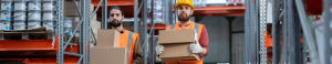 Workers demonstrating Manual Handling with boxes